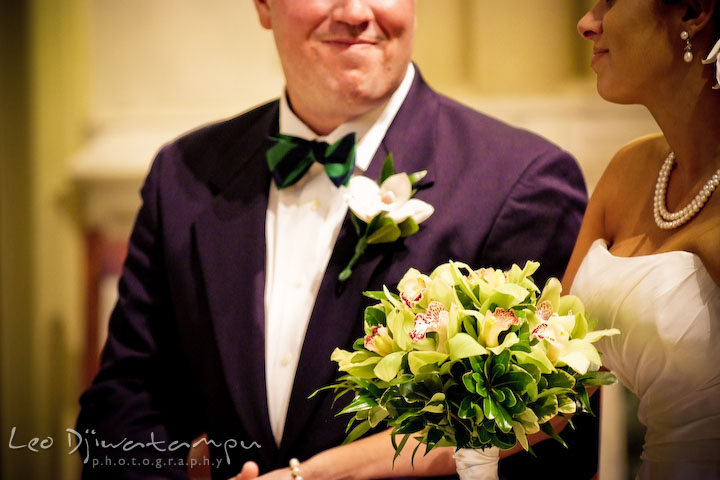 Bride's orchid bouquet and the groom's orchid boutonniere. Annapolis Wedding Photographer, Wedding at St Mary's Catholic Church Annapolis Maryland.