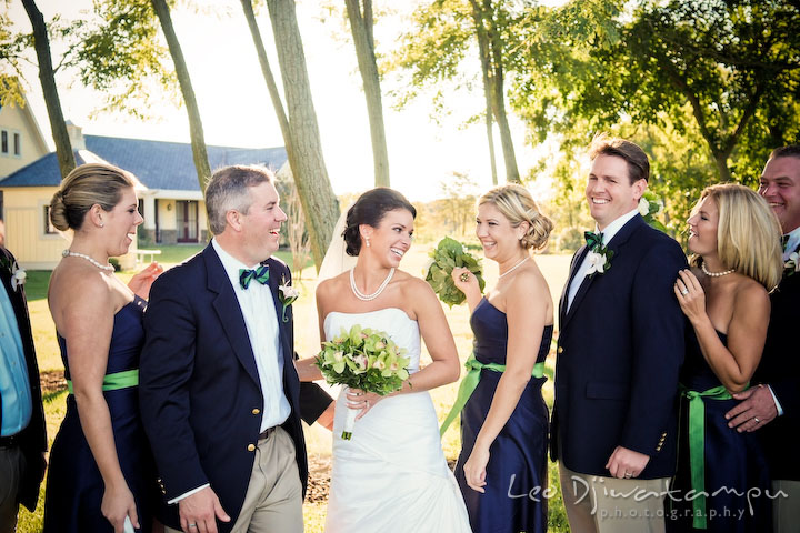 Bride, groom, maid of honor, best man, bridesmaids, and groomsmen laughing. Annapolis Kent Island Maryland Wedding Photography with live dance band at reception