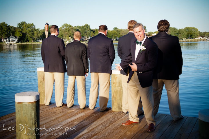 Groom, best man, and groomsmen doing funny pose. Annapolis Kent Island Maryland Wedding Photography with live dance band at reception