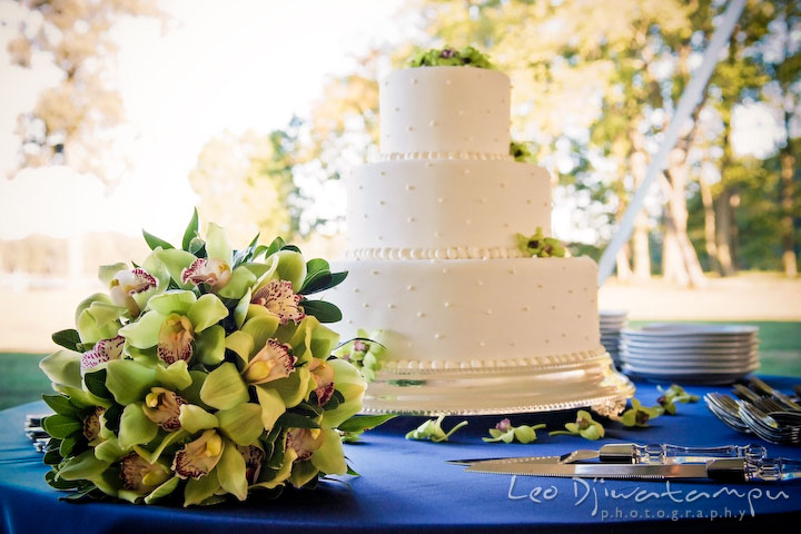 Wedding cake and the bride's orchid flower bouquet. Annapolis Kent Island Maryland Wedding Photography with live dance band at reception