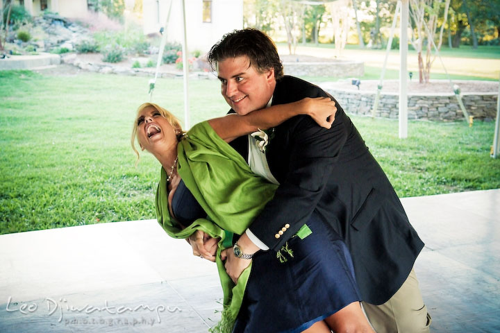 Groomsman and bridesmaid playful entrance. Annapolis Kent Island Maryland Wedding Photography with live dance band at reception