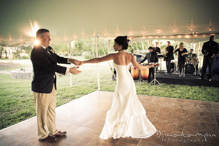 Bride and groom's first dance on the dance floor with the live band in the background. Annapolis Kent Island Maryland Wedding Photography with live dance band at reception