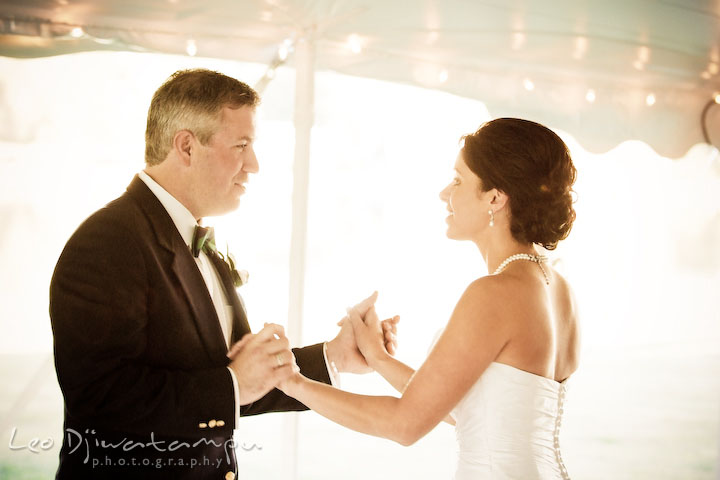 Bride ang groom holding hands and looking at each other. Annapolis Kent Island Maryland Wedding Photography with live dance band at reception