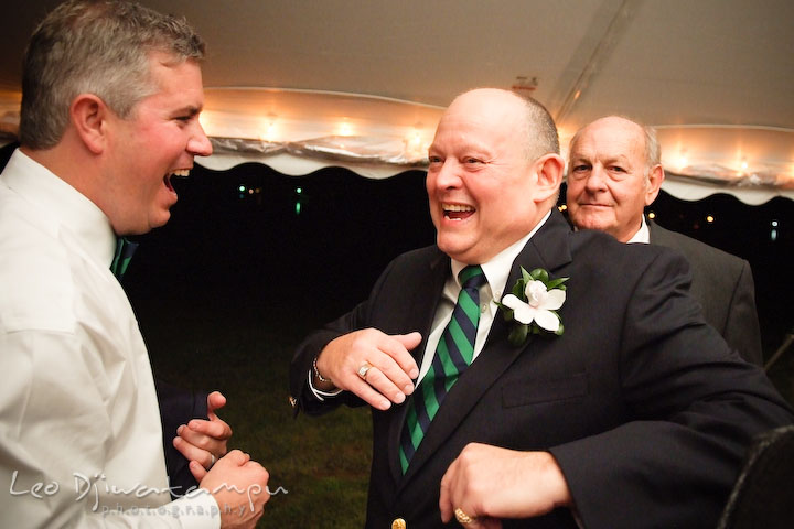 Groom and father of the bride dancing and laughing. Annapolis Kent Island Maryland Wedding Photography with live dance band at reception