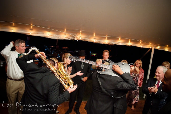 Onyx band members showing off their awesome guitar and saxophone skills. Annapolis Kent Island Maryland Wedding Photography with live dance band at reception