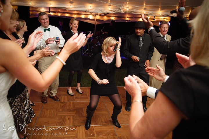 Onyx band female singer and MC entertaining guests. Annapolis Kent Island Maryland Wedding Photography with live dance band at reception