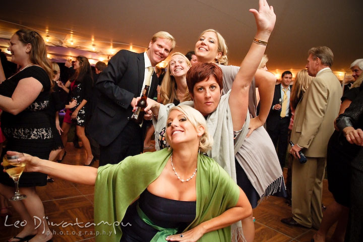 Bridesmaid, maid of honor and other guests doing wacky pose for the camera. Annapolis Kent Island Maryland Wedding Photography with live dance band at reception