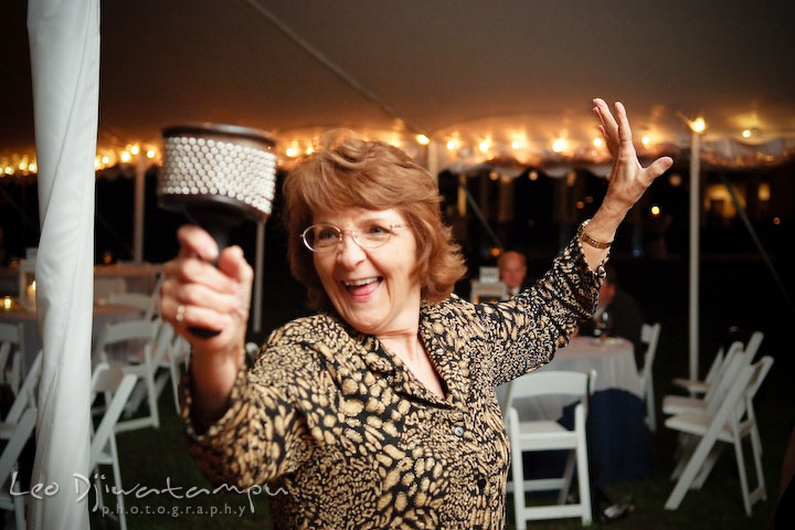 A guest playing maracas. Annapolis Kent Island Maryland Wedding Photography with live dance band at reception