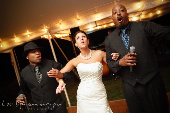 Bride dancing and singing together with the band singers. Annapolis Kent Island Maryland Wedding Photography with live dance band at reception