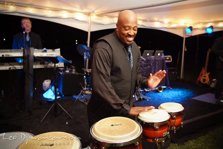 Band's vocalist playing congos. Annapolis Kent Island Maryland Wedding Photography with live dance band at reception