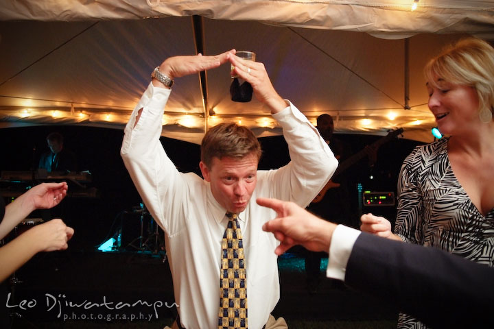 A guest doing a wacky dance pose. Annapolis Kent Island Maryland Wedding Photography with live dance band at reception