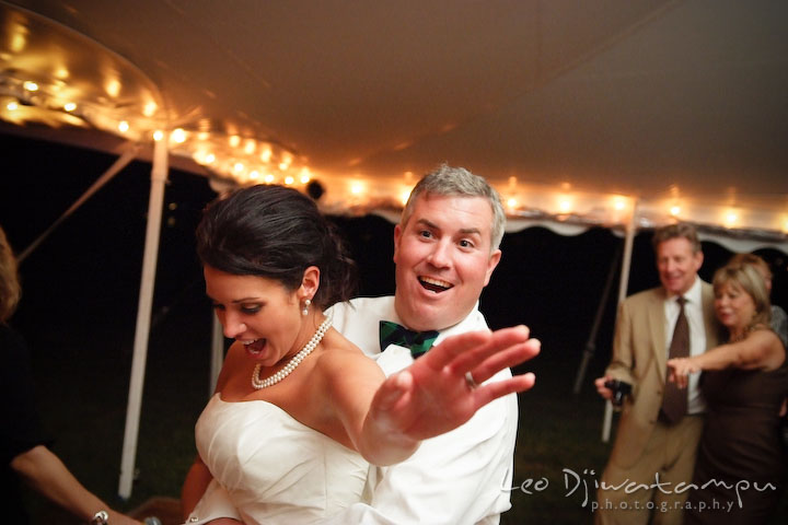 Bride and groom dancing together and having fun. Annapolis Kent Island Maryland Wedding Photography with live dance band at reception