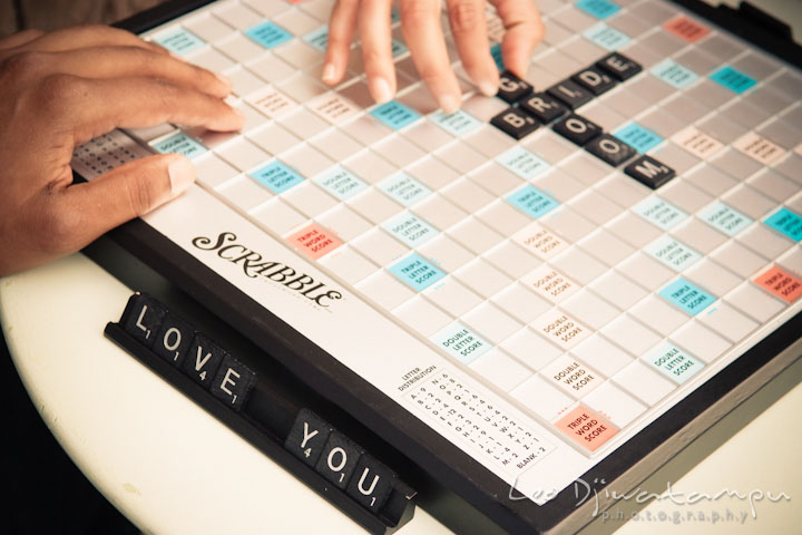 Spelling love you and bride groom on scrabble board. Annapolis Maryland USNA Pre-Wedding Engagement Photo Session by wedding photographer Leo Dj Photography