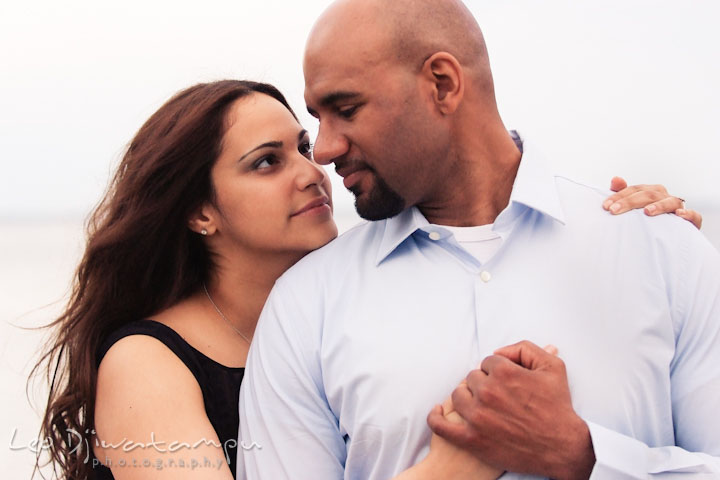 Engaged girl cuddled with her fiancé. Annapolis Maryland USNA Pre-Wedding Engagement Photo Session by wedding photographer Leo Dj Photography