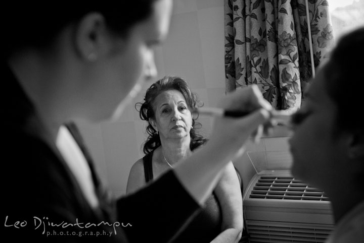 Mother of bride looking at daughter getting make up. The Grand Marquis, Old Bridge, New Jersey wedding photos by wedding photographers of Leo Dj Photography. 