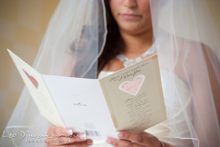 Bride reading card from groom. The Grand Marquis, Old Bridge, New Jersey wedding photos by wedding photographers of Leo Dj Photography. 