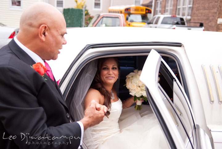 Bride's uncle help her get out of limo. The Grand Marquis, Old Bridge, New Jersey wedding photos by wedding photographers of Leo Dj Photography. 