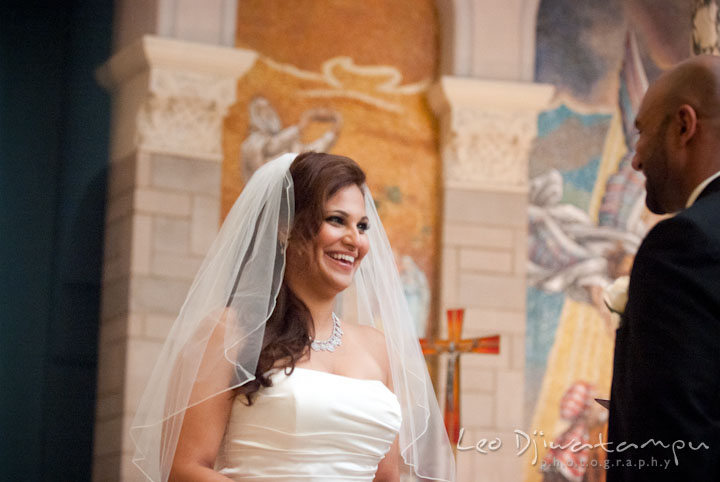 Bride laughing while reciting wedding vows to groom. The Grand Marquis, Old Bridge, New Jersey wedding photos by wedding photographers of Leo Dj Photography. 