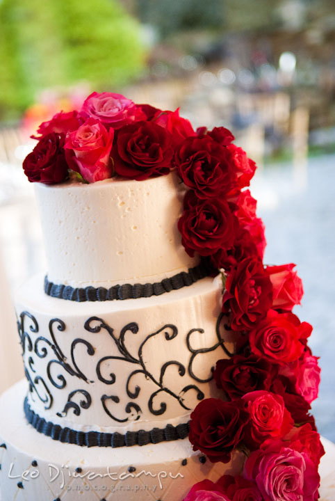 Wedding cake with real red roses. The Grand Marquis, Old Bridge, New Jersey wedding photos by wedding photographers of Leo Dj Photography.