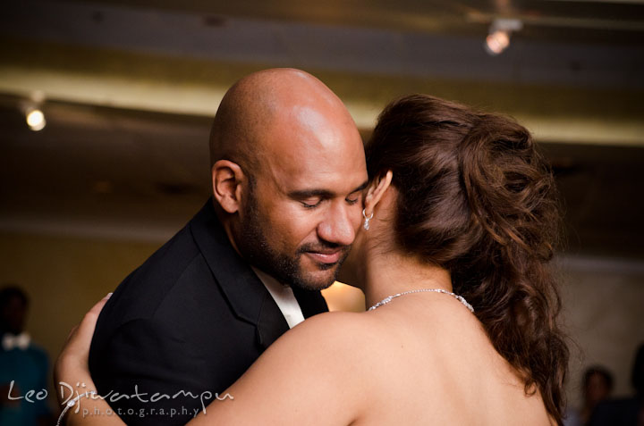 Bride and groom hugging and dancing during first dance. The Grand Marquis, Old Bridge, New Jersey wedding photos by wedding photographers of Leo Dj Photography.