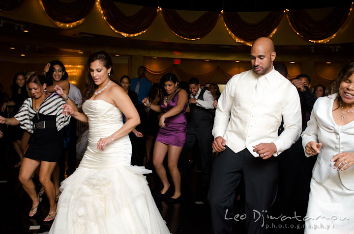 Bride, groom and guests dancing to Cupid Shuffle. The Grand Marquis, Old Bridge, New Jersey wedding photos by wedding photographers of Leo Dj Photography.