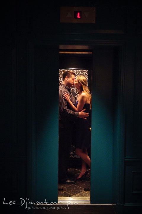 Engaged couple kissing in a cool-looking-interior elevator. Old Town Alexandria Virgina Pre-wedding Engagement Photo Session Photographer, Leo Dj Photography