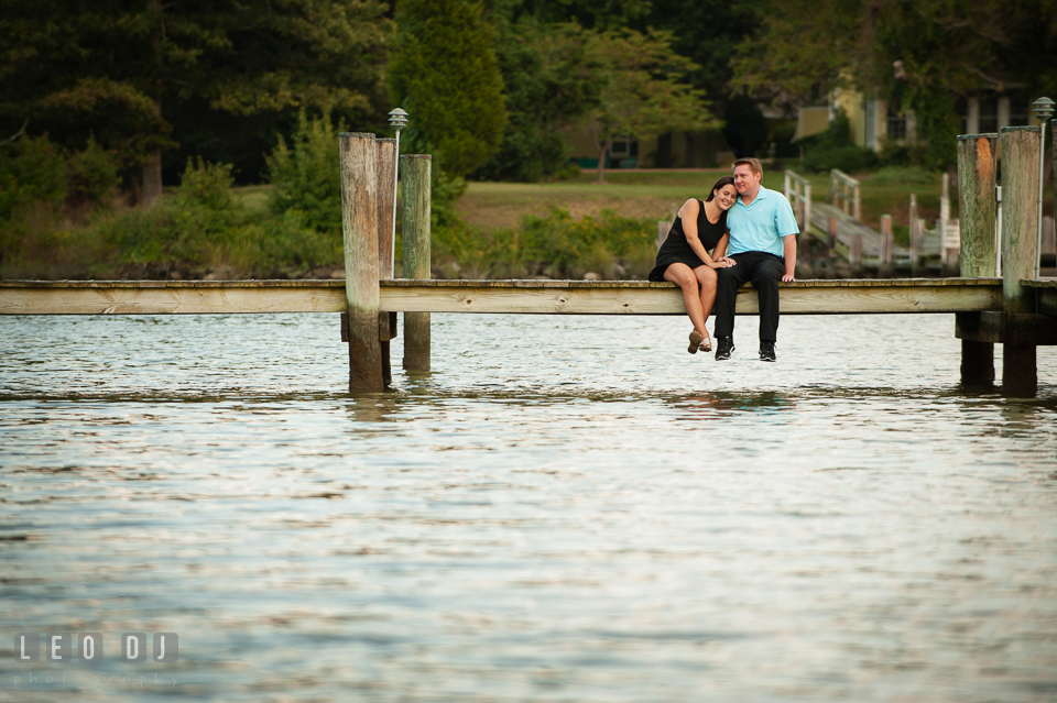 Engaged girl cuddled with her fiancé. Eastern Shore Maryland pre-wedding engagement photo session at Easton MD, by wedding photographers of Leo Dj Photography. http://leodjphoto.com