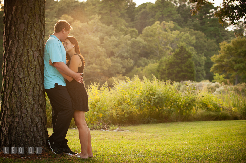 Engaged man kissed his fiancée's forehead in the garden. Eastern Shore Maryland pre-wedding engagement photo session at Easton MD, by wedding photographers of Leo Dj Photography. http://leodjphoto.com