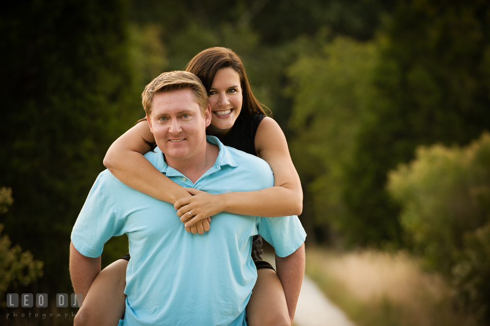 Engaged guy carrying his fiancee on his back. Eastern Shore Maryland pre-wedding engagement photo session at Easton MD, by wedding photographers of Leo Dj Photography. http://leodjphoto.com