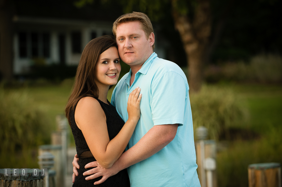 Engaged man holding tight his fiancée. Eastern Shore Maryland pre-wedding engagement photo session at Easton MD, by wedding photographers of Leo Dj Photography. http://leodjphoto.com