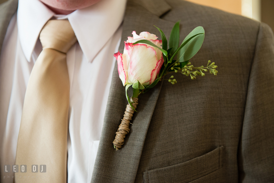 Pinned boutonniere on Groom's jacket. Hyatt Regency Chesapeake Bay wedding at Cambridge Maryland, by wedding photographers of Leo Dj Photography. http://leodjphoto.com