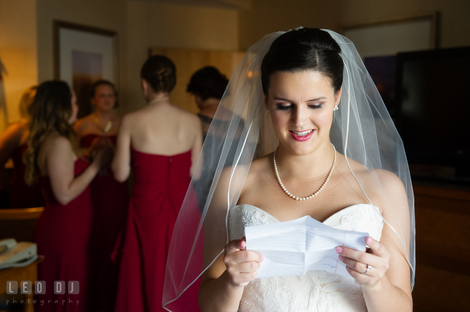 Bride reading letter from Groom. Hyatt Regency Chesapeake Bay wedding at Cambridge Maryland, by wedding photographers of Leo Dj Photography. http://leodjphoto.com