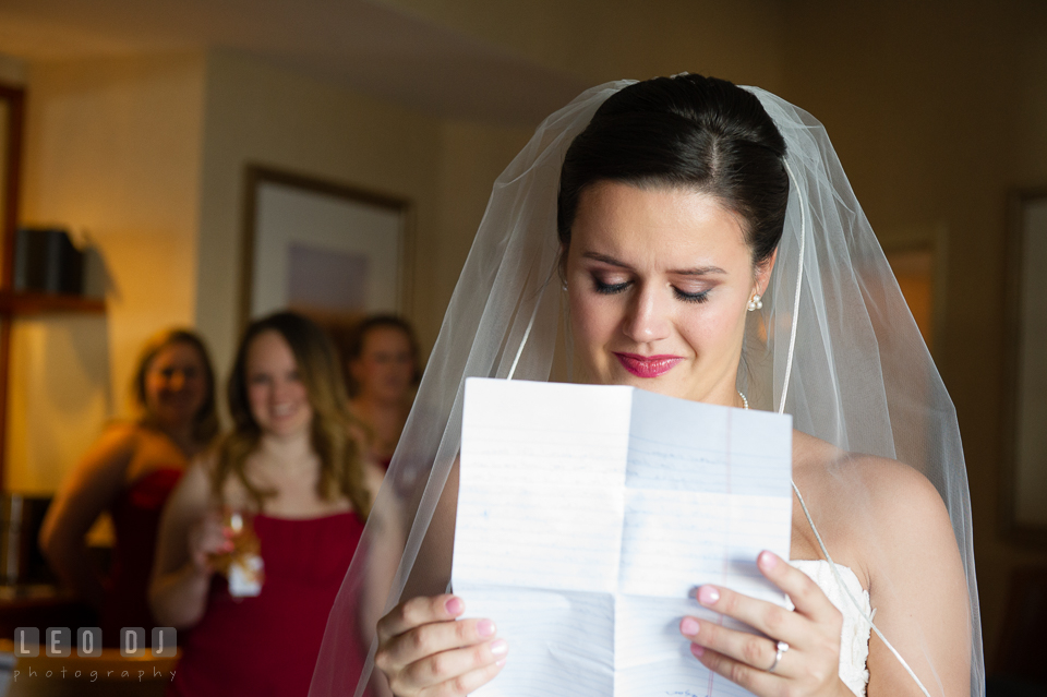 Bride is getting emotional reading letter from Groom. Hyatt Regency Chesapeake Bay wedding at Cambridge Maryland, by wedding photographers of Leo Dj Photography. http://leodjphoto.com