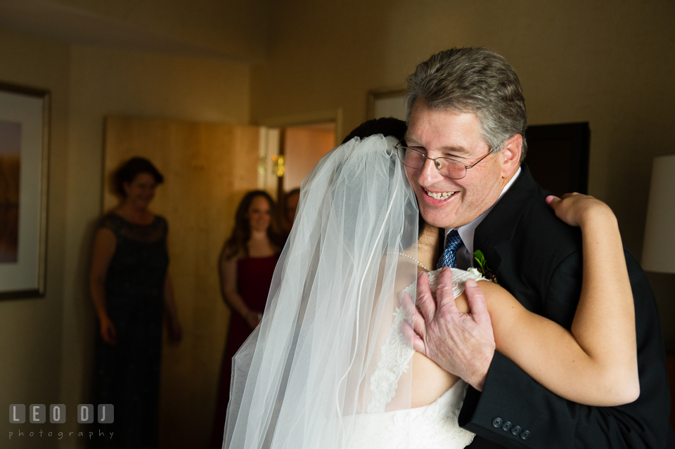 Bride hugging Father of the Bride during first look with Dad. Hyatt Regency Chesapeake Bay wedding at Cambridge Maryland, by wedding photographers of Leo Dj Photography. http://leodjphoto.com