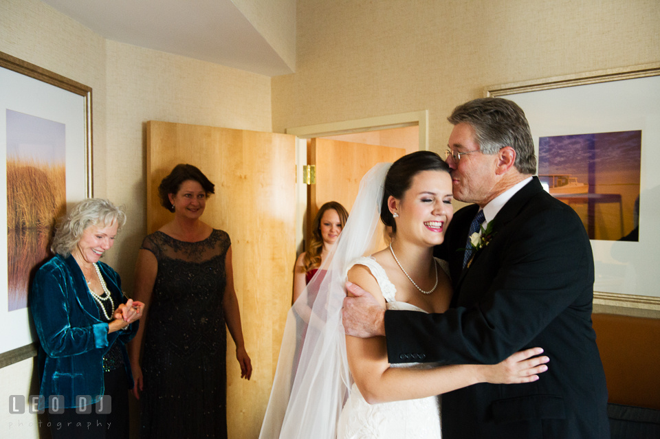 Father of the Bride kissed daughter in front of family. Hyatt Regency Chesapeake Bay wedding at Cambridge Maryland, by wedding photographers of Leo Dj Photography. http://leodjphoto.com