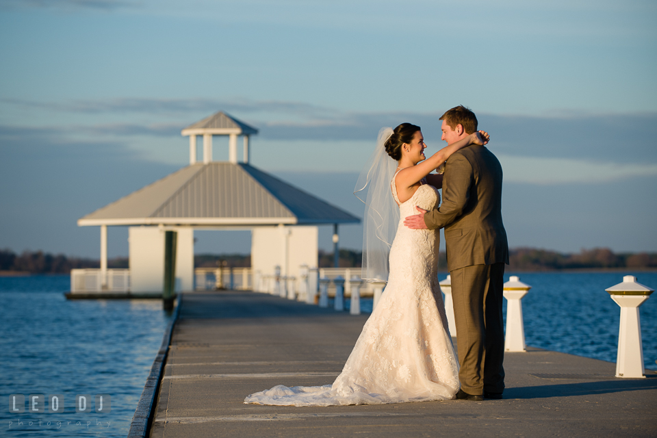 Bride and Groom on romantic photo session by the water. Hyatt Regency Chesapeake Bay wedding at Cambridge Maryland, by wedding photographers of Leo Dj Photography. http://leodjphoto.com