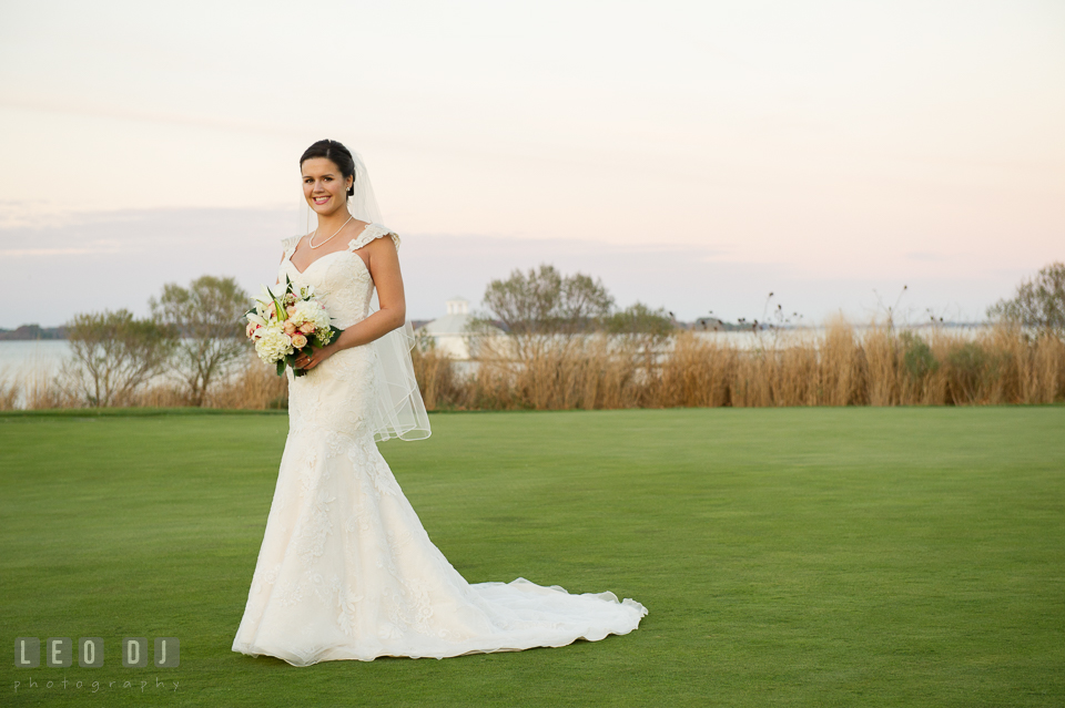 Lovely bride all smiles holding flower bouquet. Hyatt Regency Chesapeake Bay wedding at Cambridge Maryland, by wedding photographers of Leo Dj Photography. http://leodjphoto.com