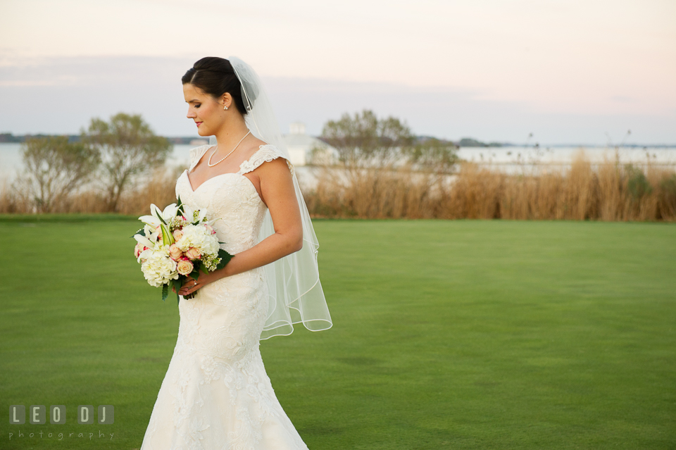 Bride with wedding flower bouquet. Hyatt Regency Chesapeake Bay wedding at Cambridge Maryland, by wedding photographers of Leo Dj Photography. http://leodjphoto.com