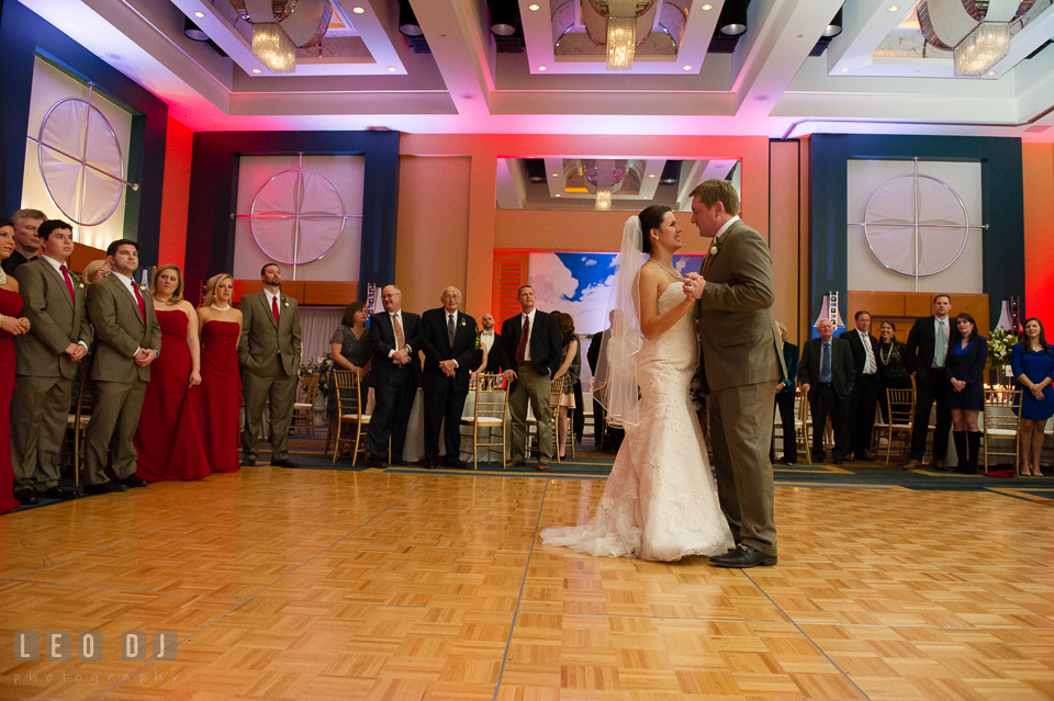 Bride and Groom's first dance seen by the wedding party and family. Hyatt Regency Chesapeake Bay wedding at Cambridge Maryland, by wedding photographers of Leo Dj Photography. http://leodjphoto.com