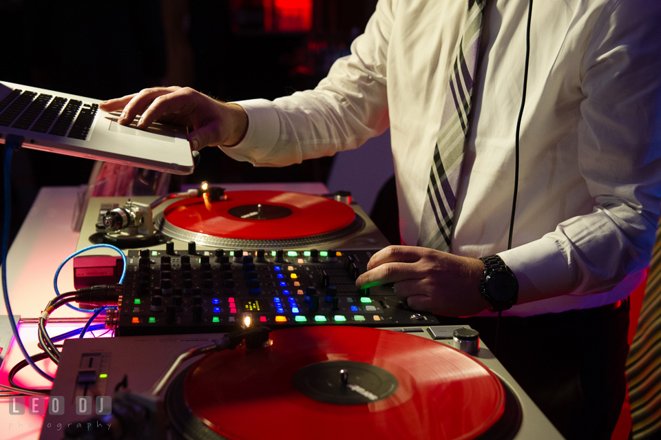 DJ Tommy Gatz mixing music for guests in wedding reception. Hyatt Regency Chesapeake Bay wedding at Cambridge Maryland, by wedding photographers of Leo Dj Photography. http://leodjphoto.com