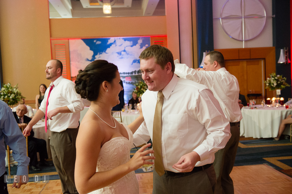 Bride and Groom having fun dancing during wedding reception. Hyatt Regency Chesapeake Bay wedding at Cambridge Maryland, by wedding photographers of Leo Dj Photography. http://leodjphoto.com