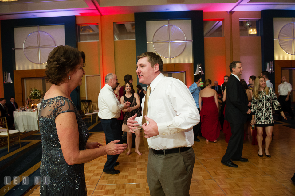 Mother of the Bride dances with Groom during wedding reception. Hyatt Regency Chesapeake Bay wedding at Cambridge Maryland, by wedding photographers of Leo Dj Photography. http://leodjphoto.com