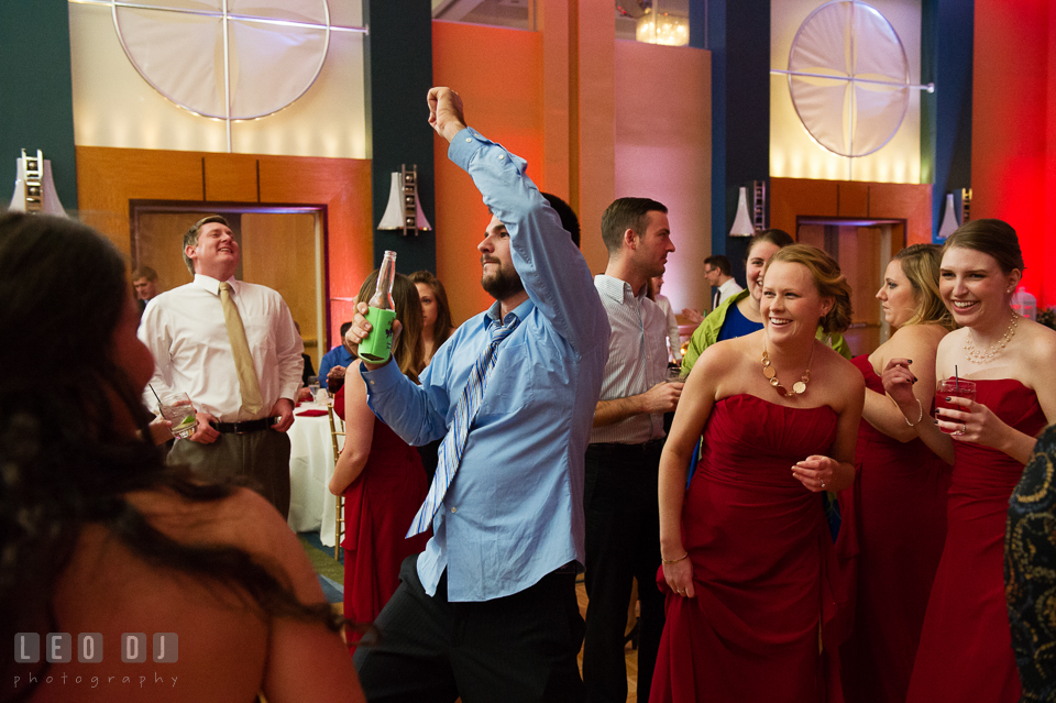 Guests having fun dancing and laughing during wedding reception. Hyatt Regency Chesapeake Bay wedding at Cambridge Maryland, by wedding photographers of Leo Dj Photography. http://leodjphoto.com