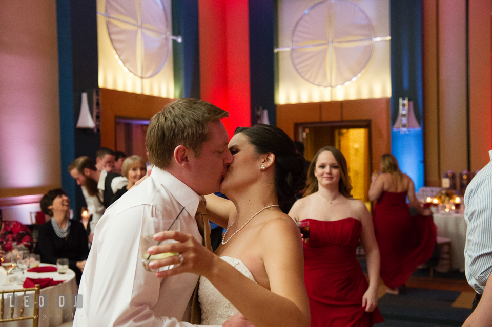 Bride and Groom kissing during wedding reception. Hyatt Regency Chesapeake Bay wedding at Cambridge Maryland, by wedding photographers of Leo Dj Photography. http://leodjphoto.com