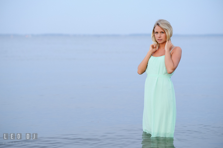 Gorgeous girl with blonde hair and long dress in the water. Kent Island and Annapolis, Eastern Shore, Maryland model portrait photo session at Sandy Point Beach by photographer Leo Dj Photography. http://leodjphoto.com