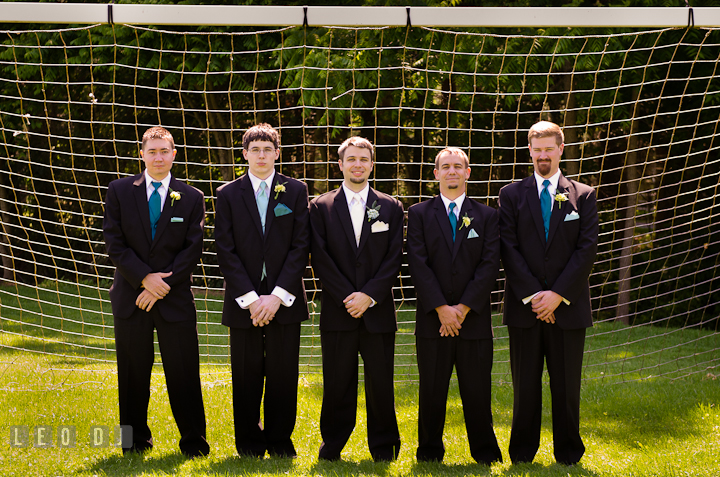 Groom, Best Man and Groomsmens posing by a soccer goal net. Ostertag Vistas wedding ceremony photos at Myersville, Maryland by photographers of Leo Dj Photography. http://leodjphoto.com