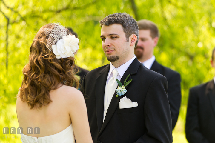 Groom looking at Bride while reciting his vow. Ostertag Vistas wedding ceremony photos at Myersville, Maryland by photographers of Leo Dj Photography. http://leodjphoto.com
