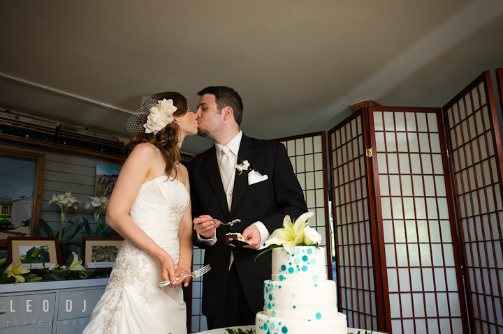 Bride and Groom kissing after eating the cake. Ostertag Vistas wedding reception photos at Myersville, Maryland by photographers of Leo Dj Photography. http://leodjphoto.com