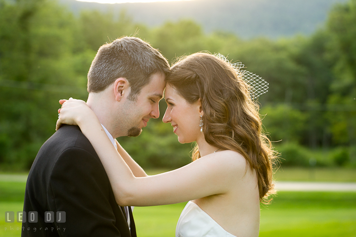 Bride and groom getting close together. Ostertag Vistas wedding reception photos at Myersville, Maryland by photographers of Leo Dj Photography. http://leodjphoto.com