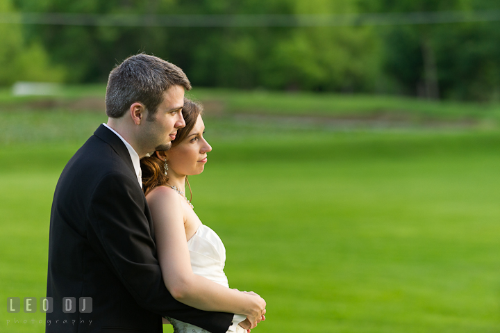 Bride and Groom cuddling and looking at the sunset. Ostertag Vistas wedding reception photos at Myersville, Maryland by photographers of Leo Dj Photography. http://leodjphoto.com